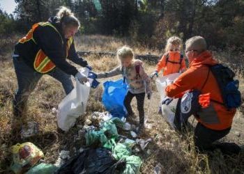 Hundreds of volunteers descend for annual Spokane River cleanup