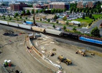 Pedestrian bridge rises in Spokane’s University District